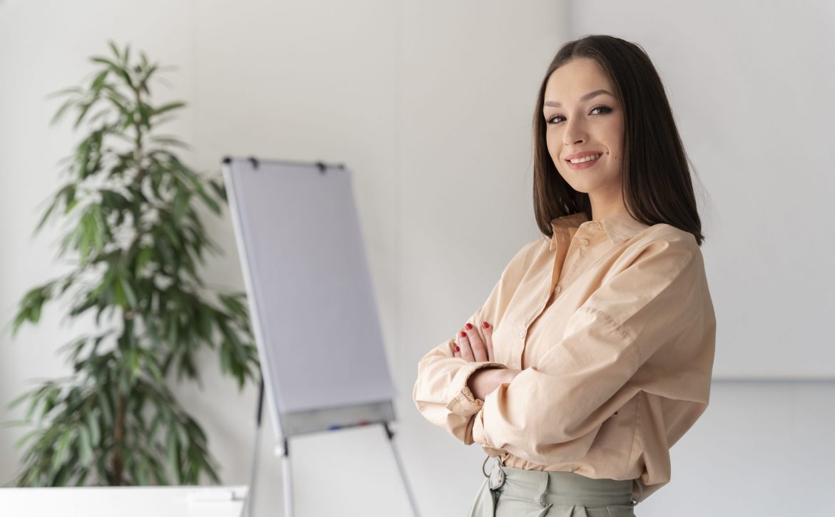 portrait-young-business-woman-posing-with-crossed-arms-scaled.jpg