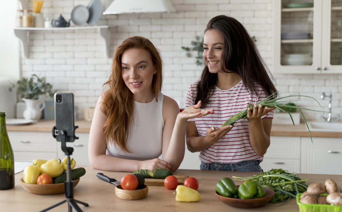 women-making-vlog-while-preparing-food (1) (1)