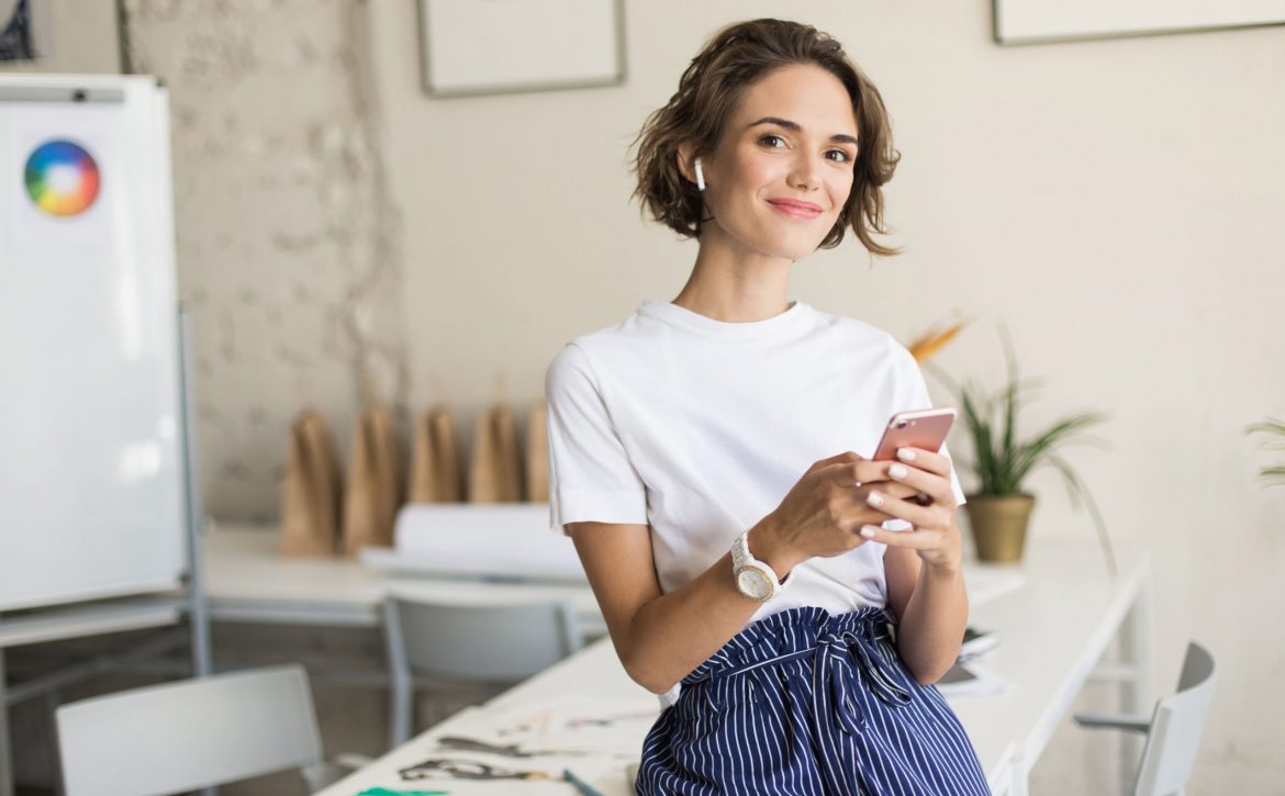 young-smiling-woman-with-short-curly-hair-wireless-earphones (1)